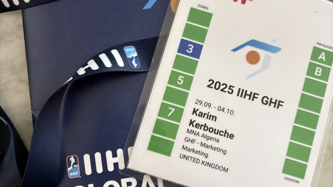 A photo of my IIHF accreditation and Global Hockey Forum booklet